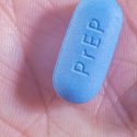 PrEP HIV prevention: Blue PrEP pill in palm of hand